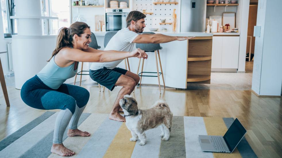 Couple exercising at home